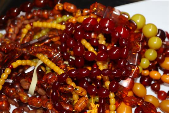 A quantity of amber and faux amber bead necklaces.